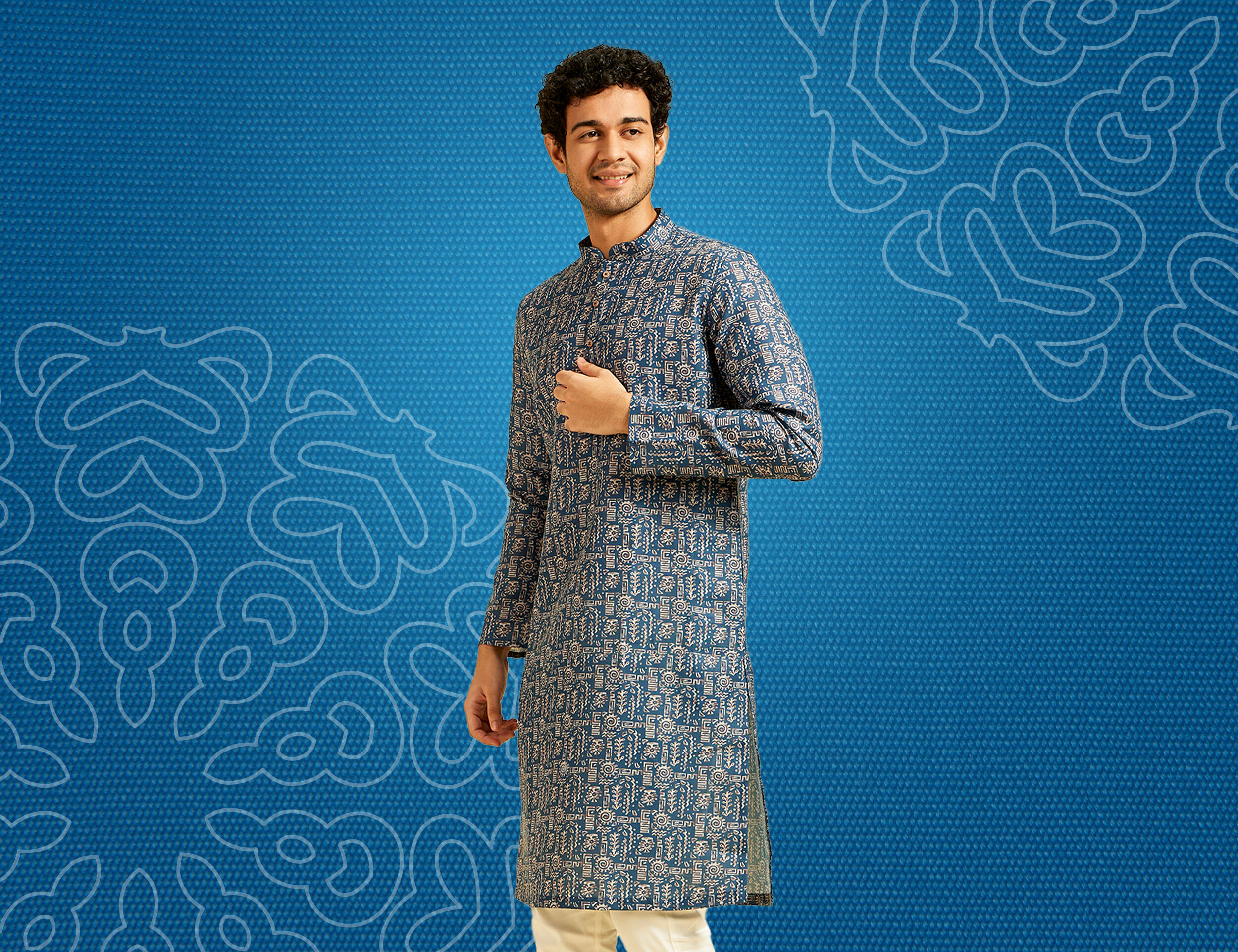 A man in printed party wear kurta set